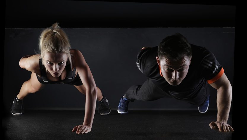 Man, woman, push-ups — The Transformative Impact of Dr. Scott Kamelle Milwaukee WI on Gynecologic Cancer Awareness and Treatm