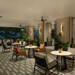 Modern lounge area in a luxury condominium with stylish furniture and plants