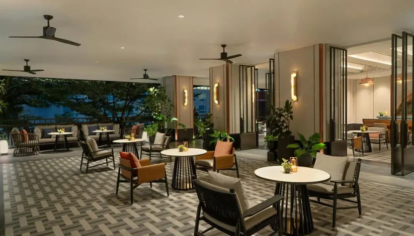 Modern lounge area in a luxury condominium with stylish furniture and plants